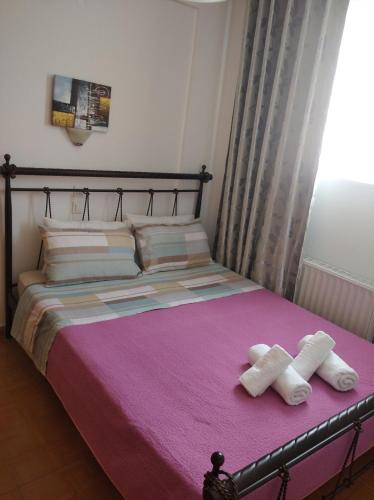 En eller flere senger på et rom på Villa Vasili