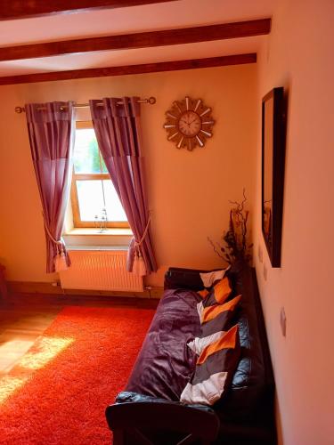 a bedroom with a bed in the corner of a room at A New U Country Cottage Apartment 2 in Valentia Island
