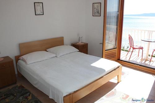 Posteľ alebo postele v izbe v ubytovaní Apartment in Pisak with sea view, balcony, air conditioning, Wi-Fi (4722-4)
