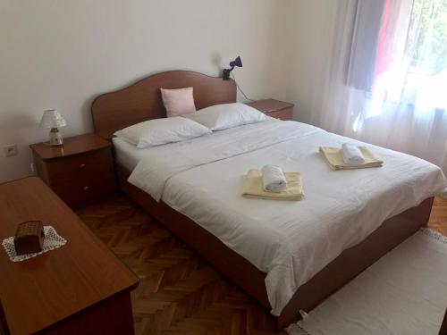 Postel nebo postele na pokoji v ubytování Apartmani RADA
