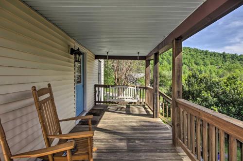 a porch with two rocking chairs on a house at Spacious Faber Home with Yard, Steps to Winery! in Faber