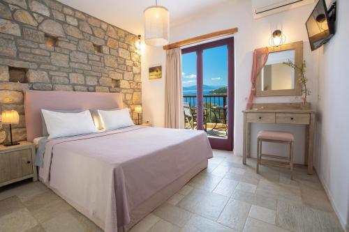 Postel nebo postele na pokoji v ubytování Amapola Boutique Villas with Sea Access - Agapi