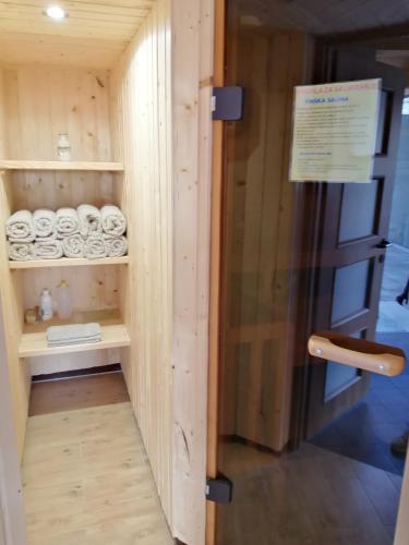 a small room with a shelf with towels at Apartment Karlovac in Karlovac