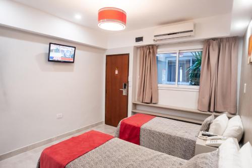 Postel nebo postele na pokoji v ubytování Hotel Termal Emperatriz Termas de Río Hondo