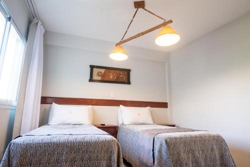 Postel nebo postele na pokoji v ubytování Hotel Termal Emperatriz Termas de Río Hondo