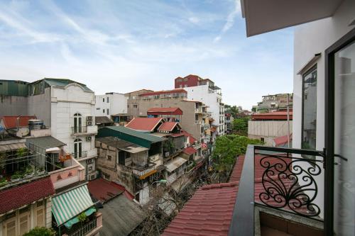 a view from a balcony of a city with buildings at Romantique Hotel De Hanoi in Hanoi