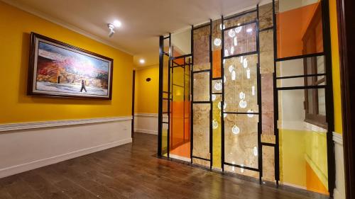 a room with a painting on the wall and a painting at Cat Cat Galerie d’Art in Sa Pa