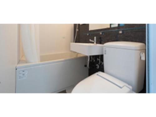 a bathroom with a toilet and a sink at R&B Hotel Nagoya Ekimae - Vacation STAY 15188v in Nagoya