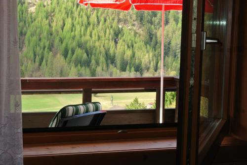 a window with a view of a mountain at Appartement Gorgasser im Berghaus Glockner in Heiligenblut