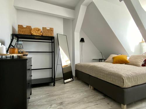 Posteľ alebo postele v izbe v ubytovaní apartament Hrabala