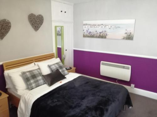 Ένα ή περισσότερα κρεβάτια σε δωμάτιο στο Burleigh Guest House