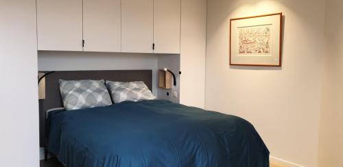 Een bed of bedden in een kamer bij Zeewaarts in Cadzand-Bad