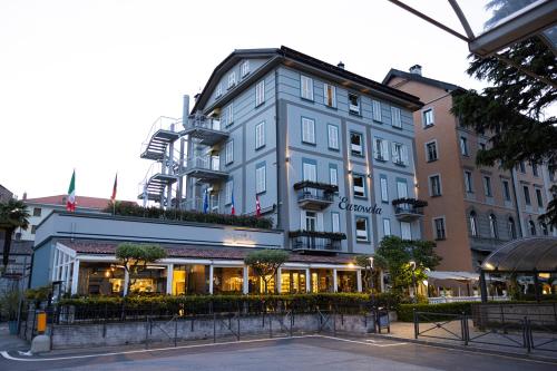 a large blue building on a city street at Hotel Ristorante Eurossola in Domodossola
