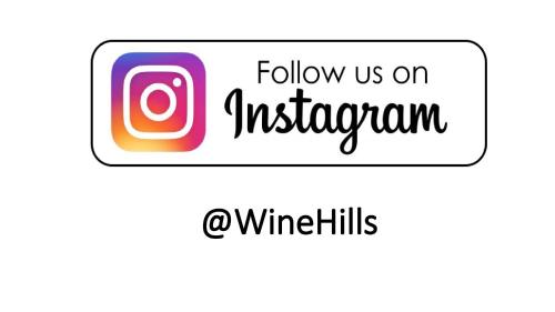 a sign with the words follow us on instagram at Wine Hills in Tbilisi City
