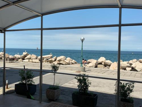 a view of the ocean from a tent at Apartment Lanterna in Piran