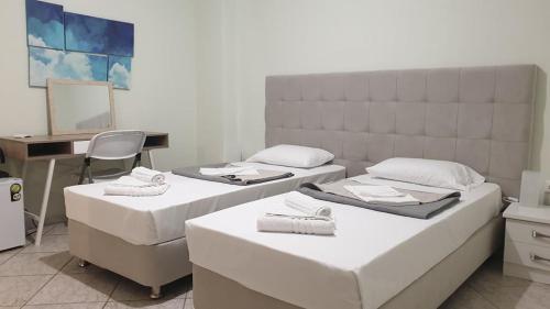 Ένα ή περισσότερα κρεβάτια σε δωμάτιο στο Vista Marina