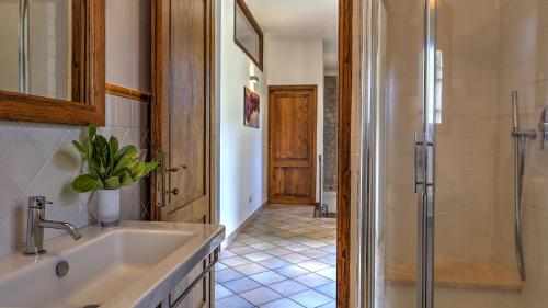 a bathroom with a sink and a shower at La Casa Di Elsa 6, Emma Villas in Santa Fiora