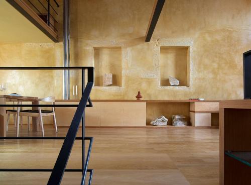 a room with a table and a dining room at Dorotheou House in Chania