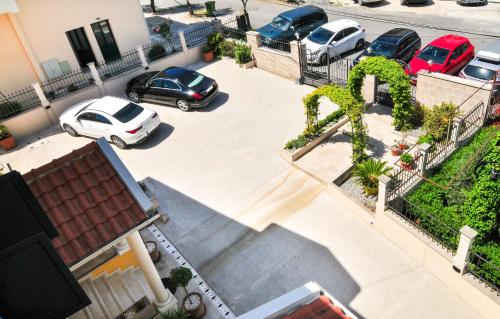 an aerial view of cars parked in a parking lot at Pontus Luxury Apartments in Tivat