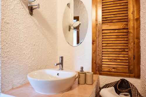 a bathroom with a white sink and a mirror at il Magàn - Cinque Terre in Corniglia
