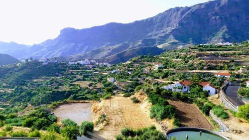 a view of a valley with a river and mountains at Casa Rural Las Cáscaras Tejeda Gran Canaria in Tejeda