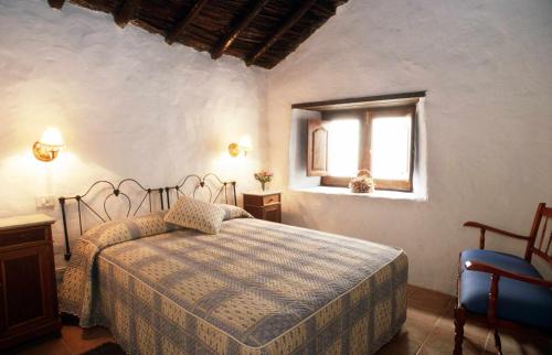 Säng eller sängar i ett rum på Casa rural El Olivar La Molienda