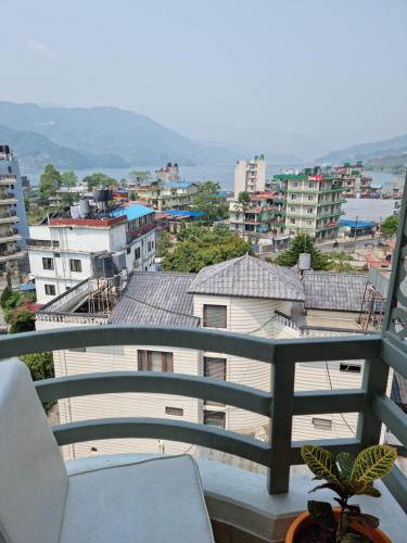 a balcony with a view of a city at Chautari Boutique Hotel in Pokhara