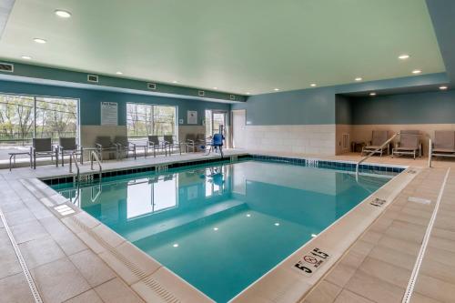a large swimming pool in a building at Holiday Inn Express & Suites - Lancaster - Mount Joy, an IHG Hotel in Mount Joy