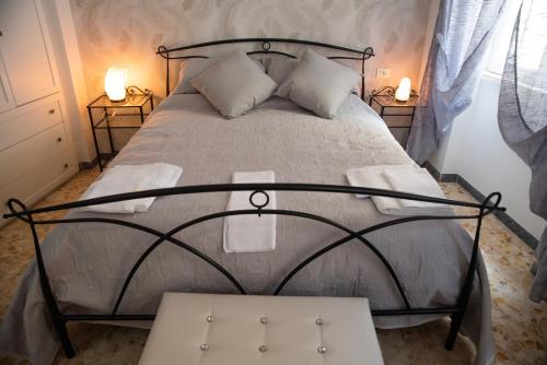 a bedroom with a bed with two night stands at casa vacanze da gabriella tivoli in Tivoli