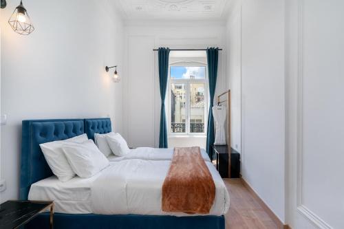Postel nebo postele na pokoji v ubytování Lisbon 5 Hotel