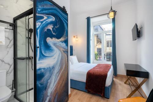 Postel nebo postele na pokoji v ubytování Lisbon 5 Hotel