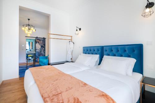 Postel nebo postele na pokoji v ubytování Lisbon 5 Hotel