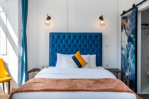 Postel nebo postele na pokoji v ubytování Lisbon 5 Hotel