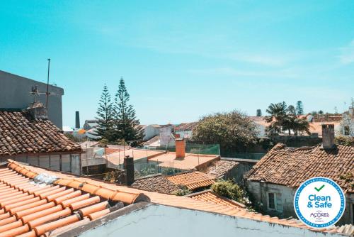 a view of roofs of buildings in a city at Vintage Place - Azorean Guest House in Ponta Delgada