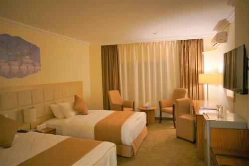 Postel nebo postele na pokoji v ubytování Silk Road Hotel