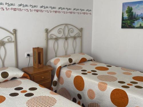 A bed or beds in a room at Casa Rural Villa Lucia