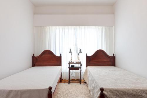 Postelja oz. postelje v sobi nastanitve Casa Da Tapada - Alcantara Riverview Apartment
