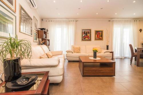 a living room with a couch and a table at Apartment Iris in Dubrovnik