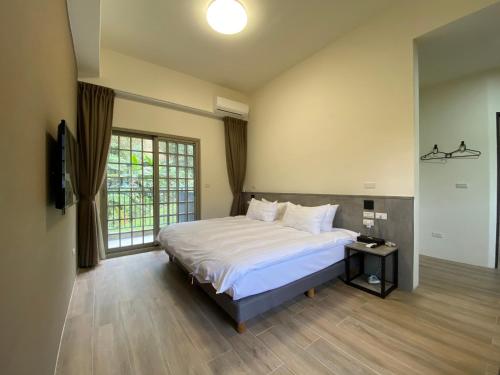 Postel nebo postele na pokoji v ubytování Sitou ARCADIA Homestay