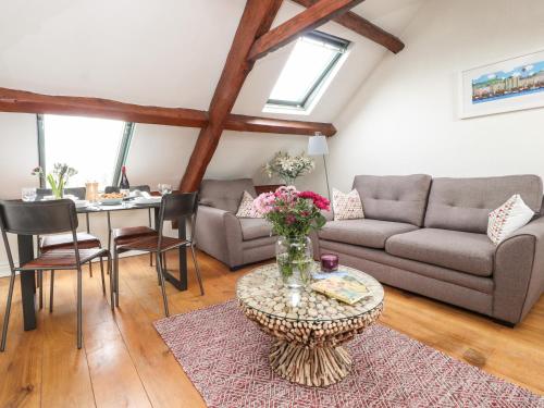 a living room with a couch and a table at 25 St Georges Quay in Lancaster