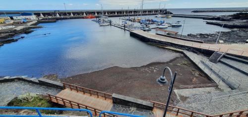 a marina with boats in the water and a dock at LA MARINA III PRIMERO B in La Restinga