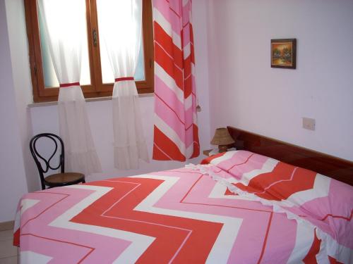 En eller flere senge i et værelse på Casa Miclara appartamento -- Ortensia
