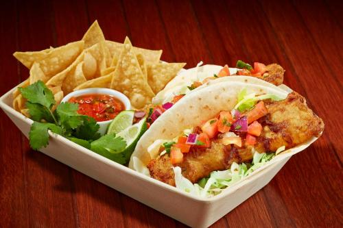 a tray of food with fish and chips and salsa at Sunnyside Resort and Lodge in Tahoe City