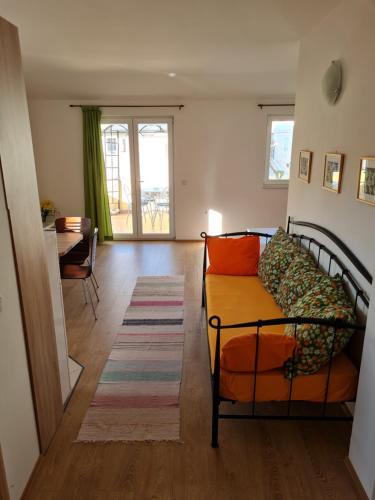 a living room with a couch and a table at Apartment Antić in Zaton