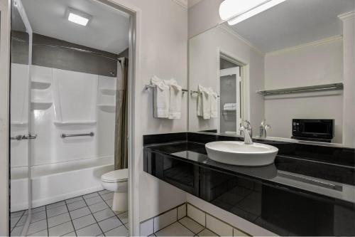 a bathroom with a sink and a toilet at Motel 6-Lodi, CA in Lodi