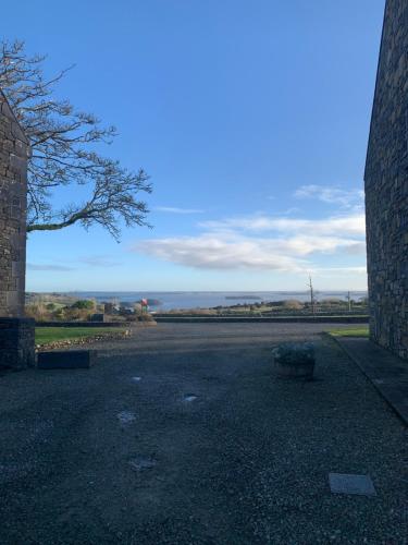 an empty parking lot with a view of the ocean at Clós Na Feirme in Galway