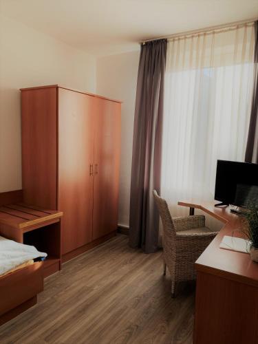TV a/nebo společenská místnost v ubytování Hotel Krasemann