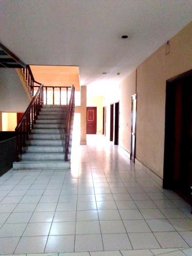 an empty hallway with stairs in a building at Hotel Indsurya in Dibrugarh