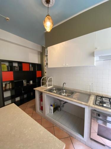 a kitchen with a sink and a counter top at Hotel Europeo Napoli in Naples
