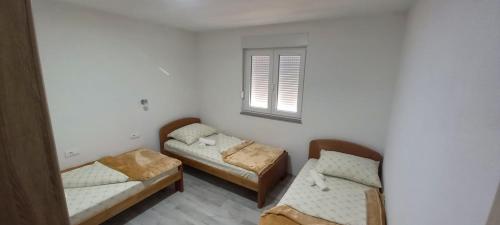 a room with two beds and a window at Spirit in Međugorje